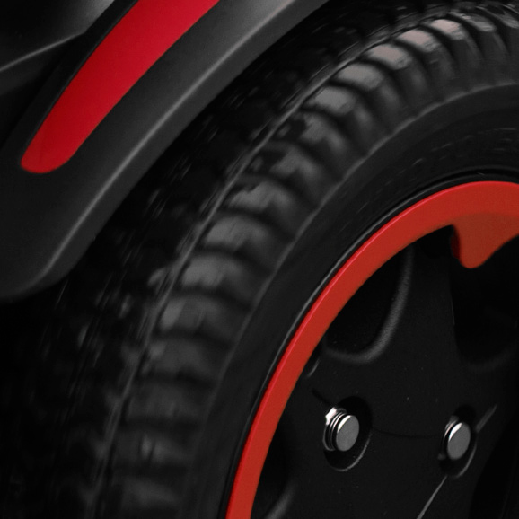 Close up of Quickie Q100 R wheel with red trim